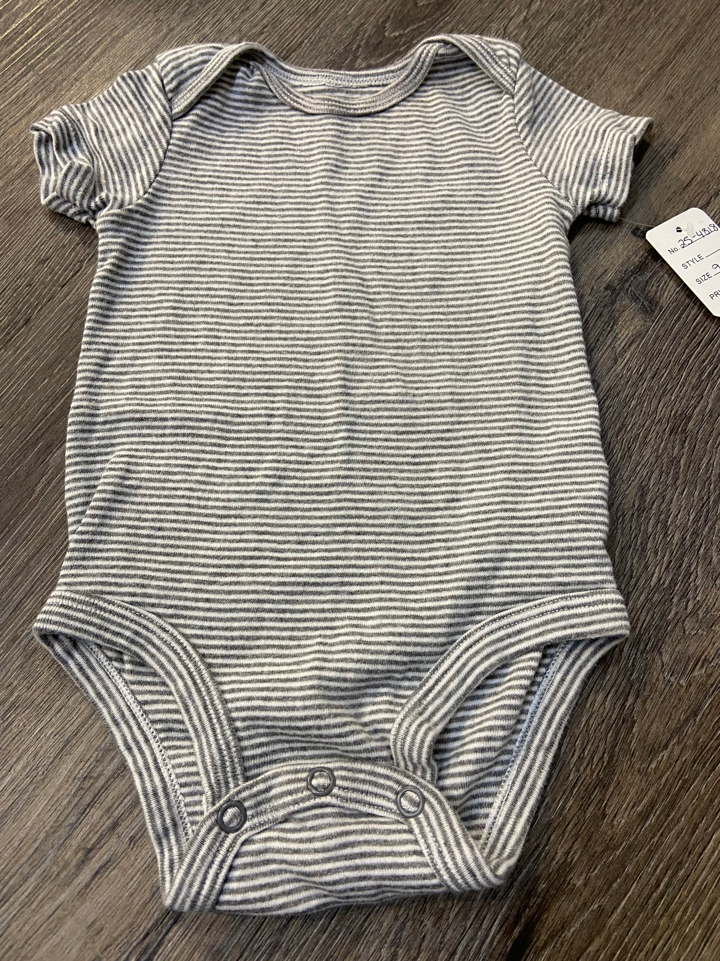 9 M “Carter’s” Onesie