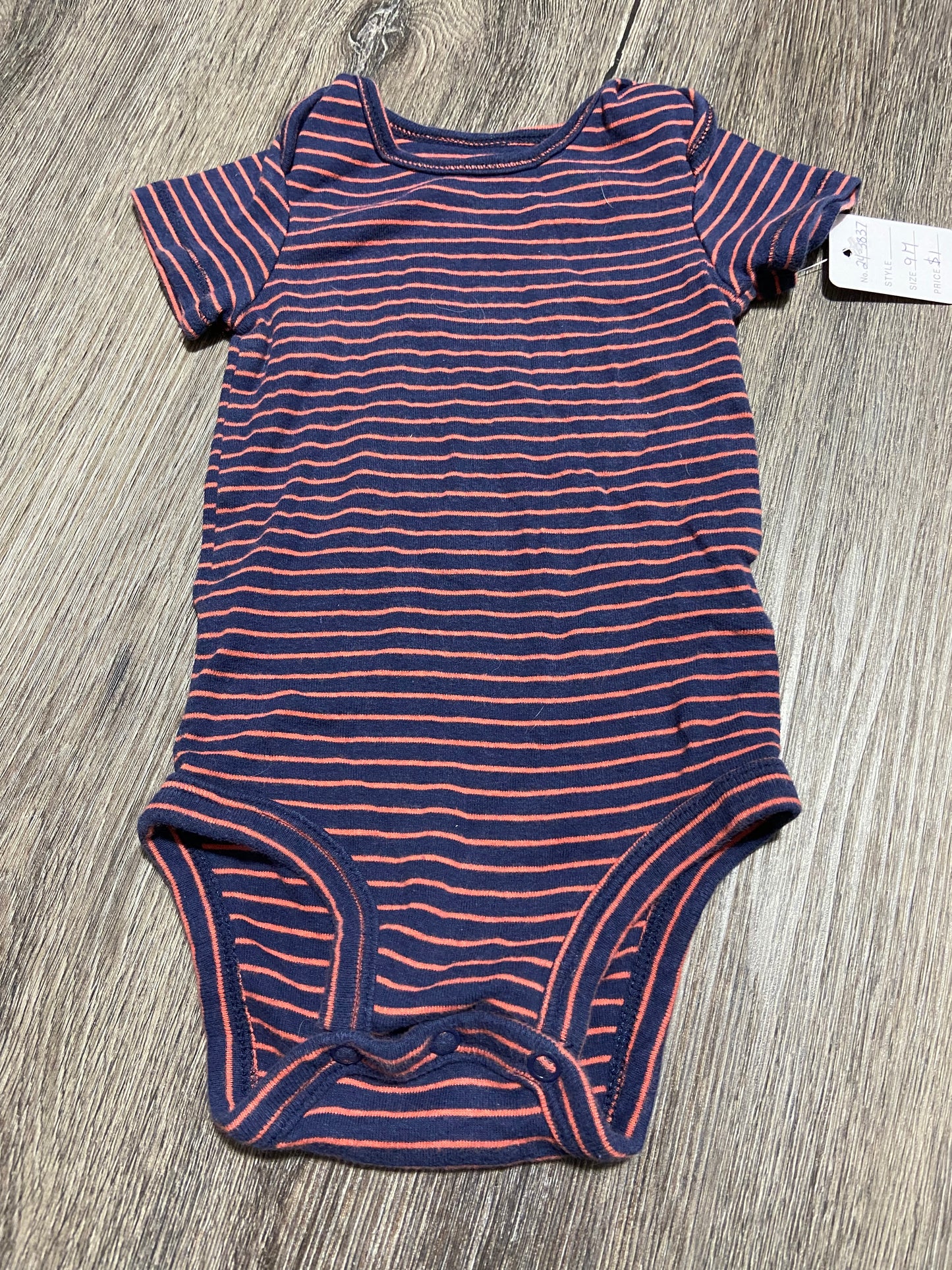 9 M “Carter’s” Onesie