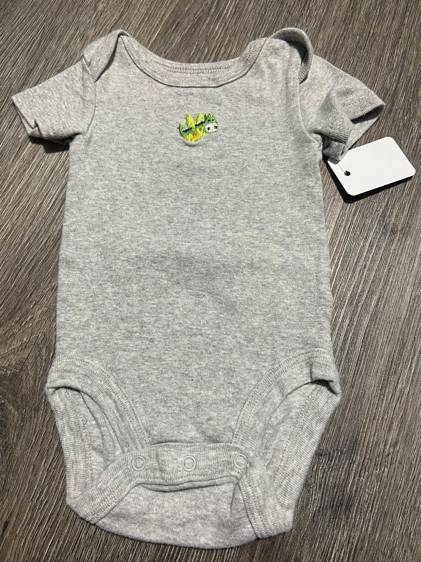 9 M “Babies R Us” Onesie